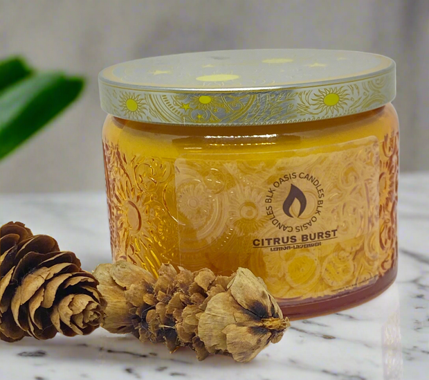Citrus Burst Luxe Candle in an amber glass vessel.  A burst of lemony zest sensational smell.